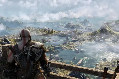 Kratos spogląda na rozległy krajobraz, zastanawiając się, ile godzin zajmie mu odkrycie wszystkich tajemnic tego świata w God of War.
