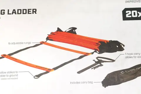 Orange agility ladder with 16 adjustable rungs, perfect for speed and acceleration drills. Includes carry bag and T-hook system.
