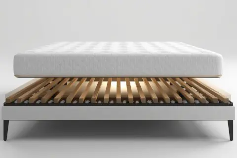 A mattress rests on a slatted bed frame, showcasing the best wood for bed slats for optimal support and breathability.
