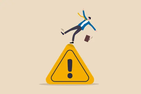 Un uomo d'affari scivola su un segnale di pericolo. Il suo maldestro tentativo di recuperare l'equilibrio è un chiaro esempio di come il near miss è una lezione preziosa.
