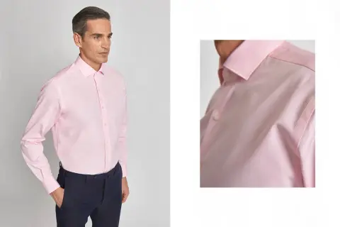 Uomo con camicia rosa e cravatta abbinata, un look elegante e raffinato.