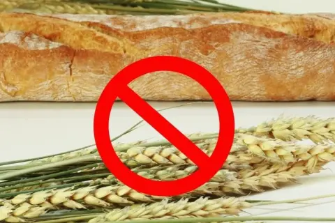 Chleb i kłosy zbóż z przekreśleniem. Symbol zakazu spożywania glutenu, ważny przy chorobie Duhringa.