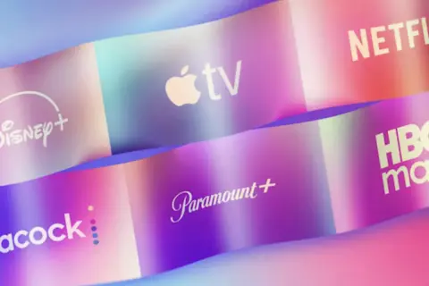 Logos of streaming services like Disney+, Apple TV, Netflix, Peacock, Paramount+, and HBO Max are displayed on colorful, wavy ribbons, showcasing the variety of what is online video.