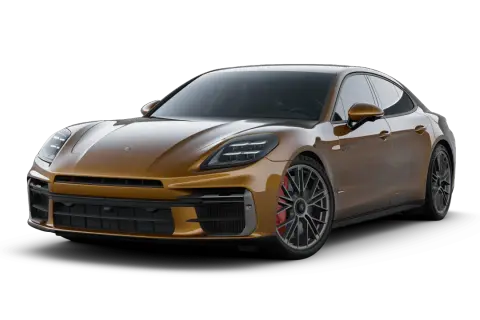 Złoty Porsche Panamera, luksusowy sedan sportowy, prezentuje swoje eleganckie linie i moc.