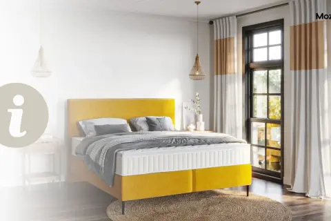 Ein gelbes Boxspringbett mit einer Matratze, die für erholsamen Schlaf sorgt.