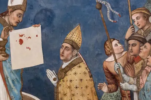 Opis sceny z Lanciano: kapłan ukazuje krwawe plamy na płótnie, symbolizujące cud eucharystyczny. Ludzie patrzą z podziwem.