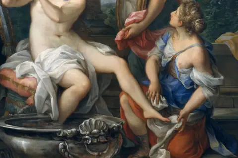 Erotic Renaissance art: A woman bathes, attended by another, in a scene of opulent sensuality.