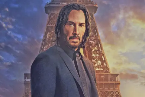 John Wick, im Anzug vor dem Eiffelturm, bereit für John Wick 5.