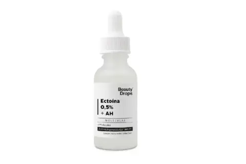 Frasco de sérum Beauty Drops con Ectoína 0,5% + AH, un suero hidratante antiedad.