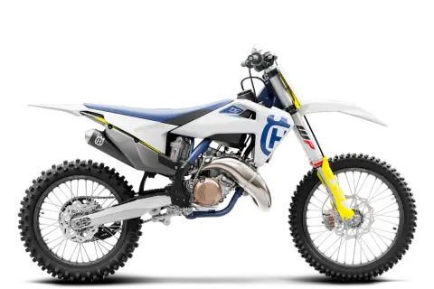 Motocykl Husqvarna TC 125 w białej i niebieskiej kolorystyce, widok z boku.