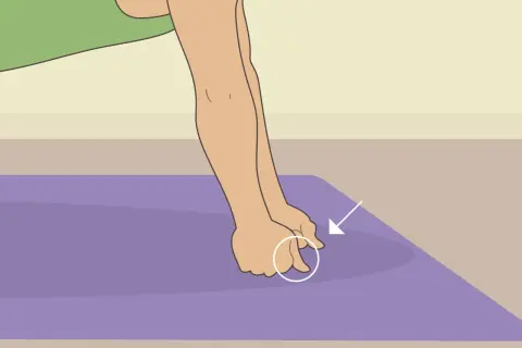Close-up of hands performing a hand conditioning exercise on a purple mat, with an arrow pointing to the fingers.