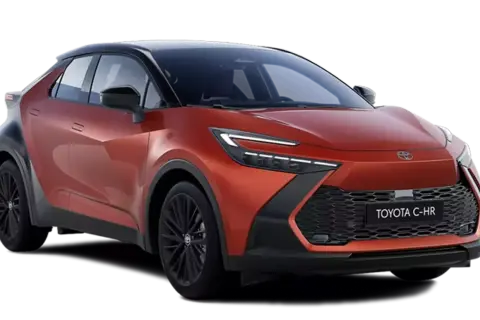 Nowy, pomarańczowy Toyota C-HR plug-in z czarnym dachem i felgami, prezentujący futurystyczny design.