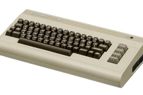 A classic Commodore 64 computer, a gateway to retro gaming and early computing, reminiscent of the era of Commodore 64 VST plugins.