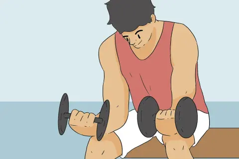 Man doing dumbbell wrist curls to learn how to get stronger wrists.