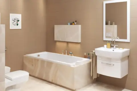 Elegancka łazienka z wanną zabudowaną, umywalką i toaletą. Jasne płytki i nowoczesne meble tworzą przytulną atmosferę.