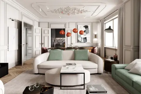 Eleganckie wnętrza modern classic z sofą w kształcie litery C, zielonymi akcentami i designerskimi lampami.