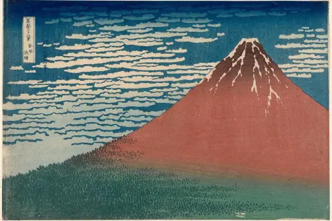 A Katsushika Hokusai artwork depicting Mount Fuji in red, with a forest at its base and a sky filled with swirling clouds.