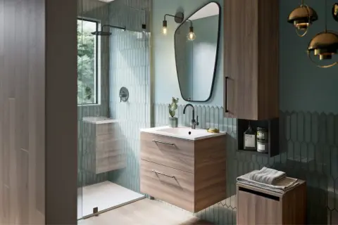 Salle de bain moderne avec douche vitrée, meuble vasque en bois, miroir asymétrique et carrelage vert d'eau. La taille moyenne d'une salle de bain est bien représentée.