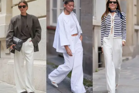 Trzy kobiety prezentują eleganckie białe spodnie w różnych stylizacjach. Jedna w brązowej marynarce, druga w białym komplecie, trzecia w granatowo-białym sweterku.