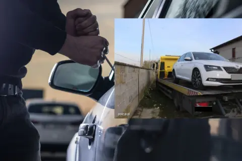 Próba kradzieży samochodu zakończona. Białe auto na lawecie, złodziej zatrzymany.