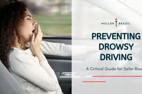 Preventing drowsy driving is crucial, especially for those with conditions like narcolepsy. This image shows a woman yawning while driving, highlighting the dangers.