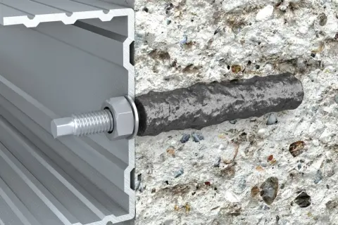 Przekrój kotwy chemicznej w betonie i profilu aluminiowym.