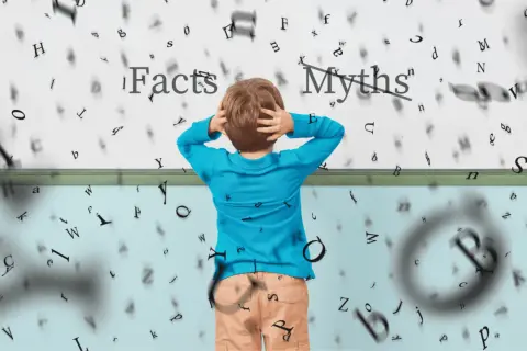 Jongen met handen in het haar, omringd door zwevende letters. Boven hem staat 'Facts' en 'Myths', wat de uitdaging van wat is begrijpend lezen illustreert.
