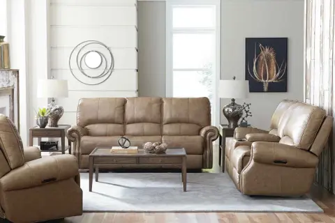 A cozy living room featuring a tan leather sofa and recliners, perfect for a Bassett Furniture identification and value guide.
