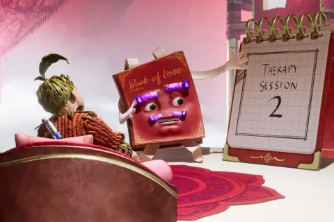 It takes two - poradnik": Książka "Book of Love" i kalendarz z napisem "Therapy Session 2" sugerują, że para potrzebuje pomocy.