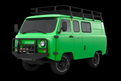 Zielony van UAZ z bagażnikiem dachowym i wyciągarką, gotowy na przygodę. Ta marka samochodu na u to symbol wytrzymałości.