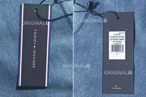 Dwa metki odzieżowe Tommy Hilfiger na niebieskim tle.