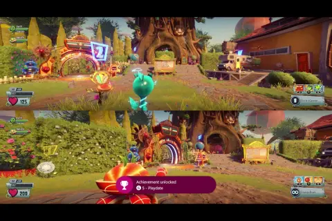 Gry split screen Xbox w Plants vs. Zombies. Dwa ekrany pokazują kolorową, kreskówkową rozgrywkę z postaciami roślin i zombie.