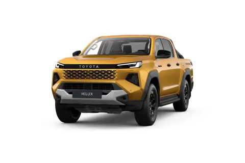 Złoty Toyota Hilux z czarnymi dodatkami i nowoczesnym grillem, gotowy na każdą przygodę.