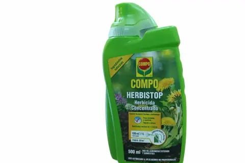 Bouteille verte de désherbant Compo Herbistop, à base d'acide pélargonique, pour un jardin sans mauvaises herbes.