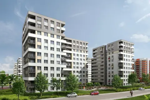 Nowoczesne budynki mieszkalne na osiedlu Avia Kraków. Zieleń, chodniki i samochody tworzą przyjazną przestrzeń.