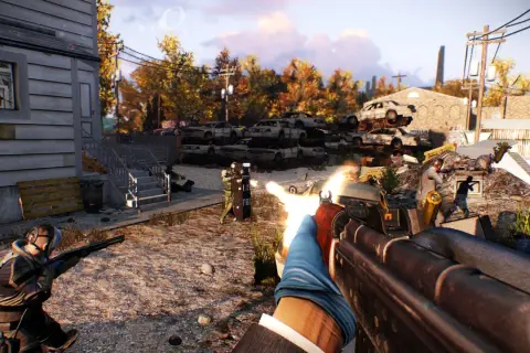 Gracze strzelają do policjantów w Payday 2 na tle zniszczonego krajobrazu.