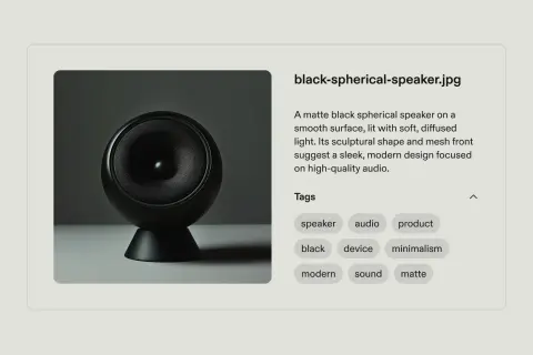 A matte black spherical speaker, a sleek modern audio device, perfect for developing a content taxonomy.