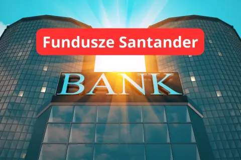 Nowoczesny budynek banku z napisem "BANK" i czerwonym banerem "Fundusze Santander". Słońce przebija się przez chmury.