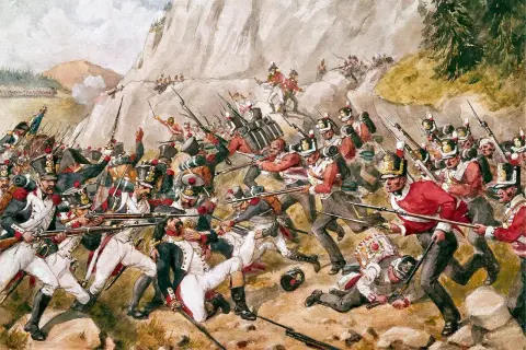 Intens strid under slaget vid Waterloo. Soldater i röda uniformer kämpar mot fienden i en kaotisk scen.