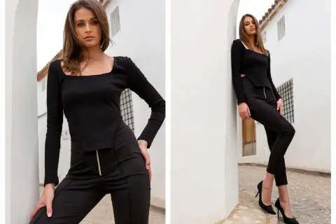Eleganckie tureckie ubrania damskie: czarny prążkowany top z kwadratowym dekoltem i dopasowane spodnie z zamkiem.