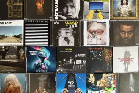 A collage of CD covers, featuring 80s artists like Kim Wilde and A Flock of Seagulls, alongside modern music.