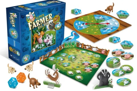Pudełko gry Super Farmer Big Box, plansza z kołem losu, zagroda z żetonami zwierząt, kostki i figurki zwierząt.