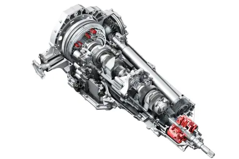 Przekładnia s tronic z widocznymi elementami hydraulicznymi i mechanicznymi.