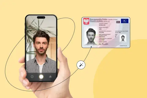 Mężczyzna robi sobie zdjęcie telefonem, obok widoczny dowód osobisty.