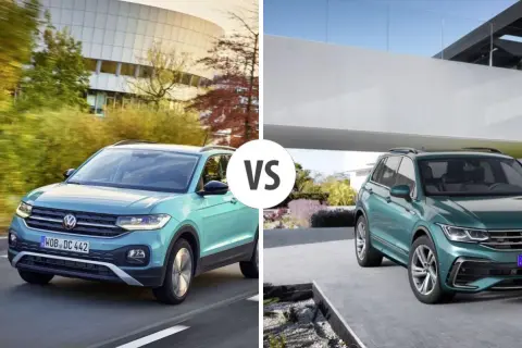 Dwa zielone SUV-y marki Volkswagen, jeden w ruchu, drugi zaparkowany.
