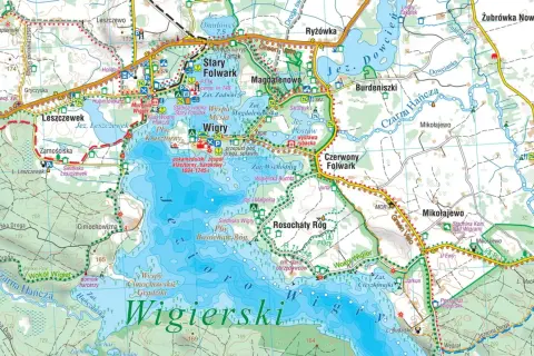 Mapa turystyczna Wigierskiego Parku Narodowego z zaznaczonymi jeziorami, rzekami, drogami i atrakcjami, m.in. klasztorem kamedułów.