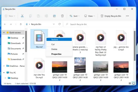 Recycle Bin shows a deleted file.mxf, a video file, with a context menu open offering to restore it.