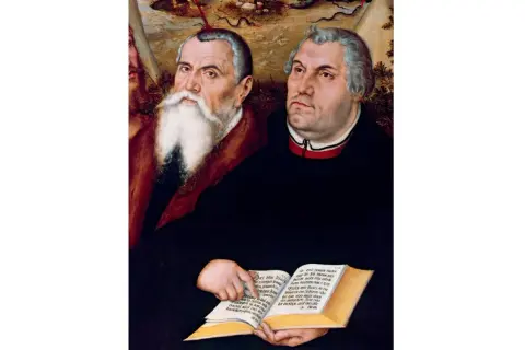 Portret Marcina Lutra i Filipa Melanchtona, wybitne lucas cranach starszy dzieła. Postacie trzymają otwartą księgę z tekstem.