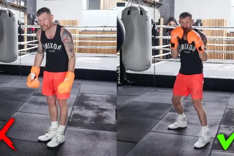 Boxer demonstrates the correct stance for a right hook, showing proper footwork and guard.