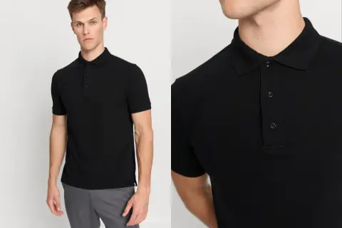 Ein Mann präsentiert ein schwarzes Polohemd, das sich vielseitig kombinieren lässt. Perfekt zu grauen Chinos für einen lässigen Look.